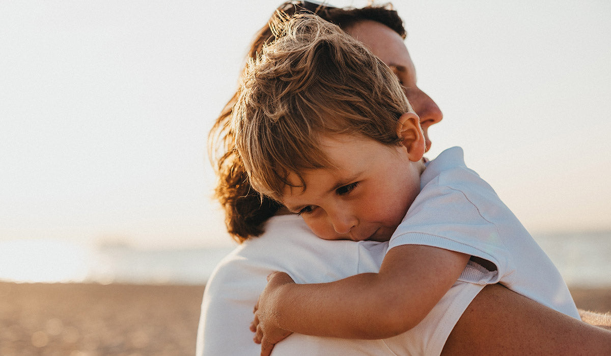 A parent and child sharing a hug